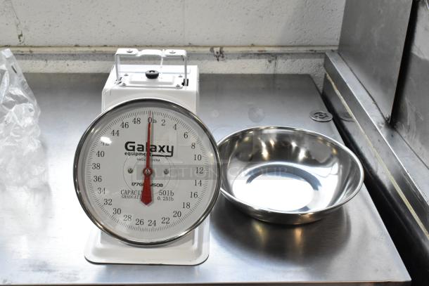 Galaxy Metal Countertop Food Portioning Scale, 50lb capacity, stainless steel finish, clear dial, well-maintained condition.
