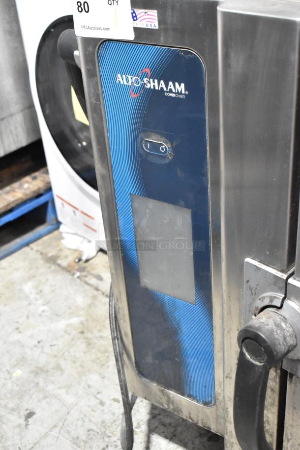 Alto Shaam 7.14 ESI stainless steel combi oven with equipment stand. Note: broken glass visible. 208-240V, 3 phase.