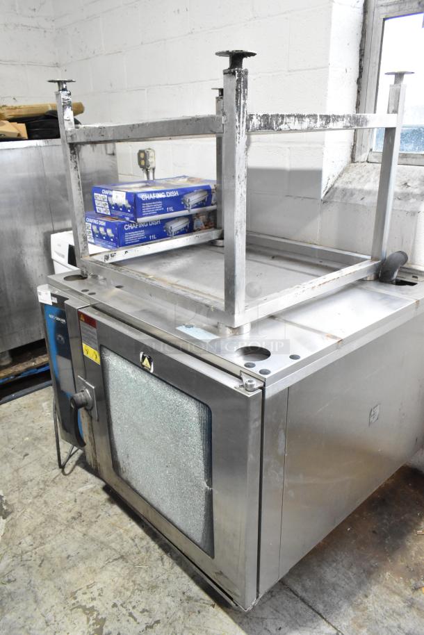 Alto Shaam 7.14 ESI stainless steel combi convection oven with equipment stand. Features broken glass door, three-phase.