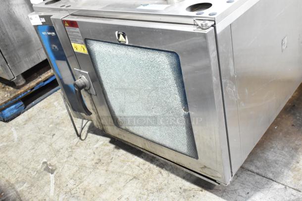 Alto Shaam 7.14 ESI stainless steel combi convection oven with broken glass, 208-240V, 3-phase. Includes equipment stand.