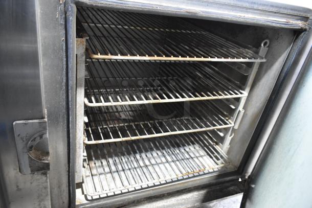 Alto Shaam 7.14 ESI combi convection oven, stainless steel, interior racks, visible wear, 208-240V, 3-phase, broken glass noted.