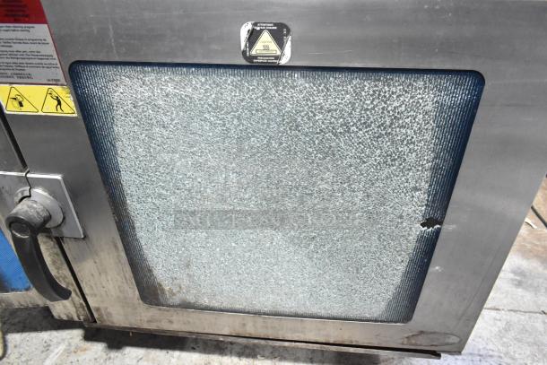 Alto Shaam 7.14 ESI stainless steel combi oven with broken glass door, on equipment stand. 208-240V, 3-phase.