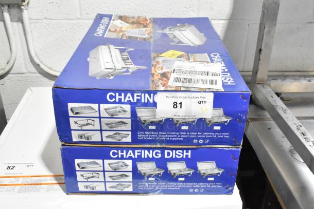 Brand new metal chafing dishes, scratch and dent condition, in original packaging, includes steam and water pan, and two fuel holders.