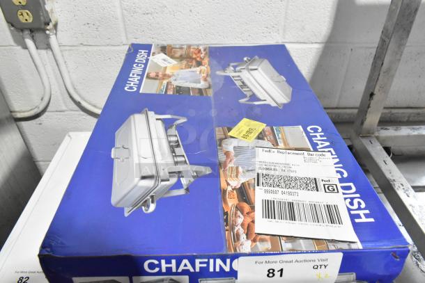 Blue box with 2 new scratch and dent metal chafing dishes. Includes FedEx labels and auction note for double bid offer.