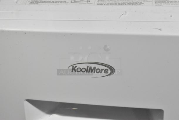 KoolMore front load washer, brand new but with visible scratches, featuring metal construction and manufacturer's logo.