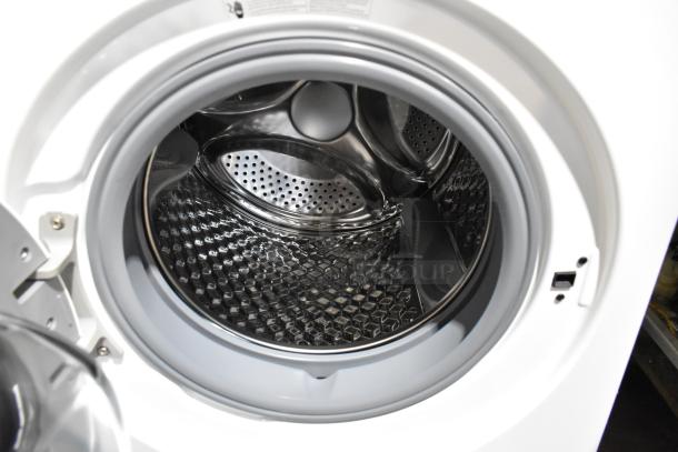 KoolMore front load washer with metal drum. Brand new, labeled as scratch and dent. Spacious interior and sleek design.