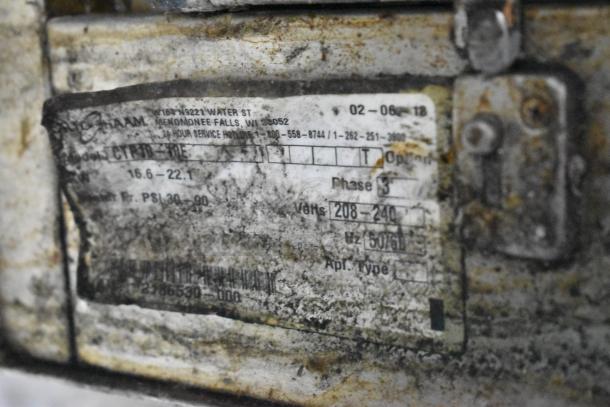 Alto Shaam CTP18-10E combi oven label, showing model, voltage, and phase. Label is worn and stained.