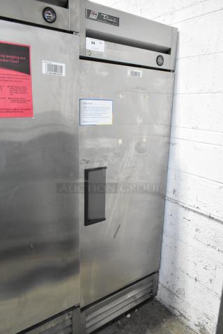 2017 True T-19F stainless steel commercial reach-in freezer with black handle and poly-coated racks. Tags indicate model info.