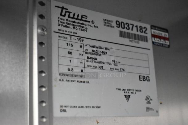 2017 True T-19F stainless steel commercial freezer label, features 115 volts, 1 phase. Serial number 9037182.