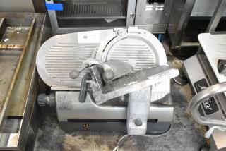 Hobart 2912 stainless steel commercial meat slicer, automatic, countertop model, 120 volts, visible usage marks, intact condition.