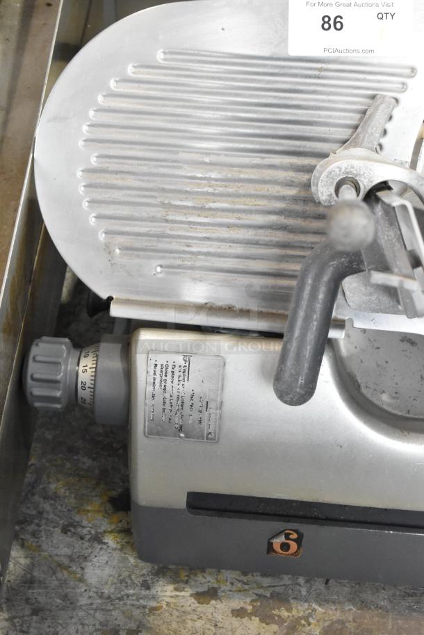 Hobart 2912 stainless steel meat slicer, 120V, 1-phase, visible dials and adjustment knob, shows some signs of use.