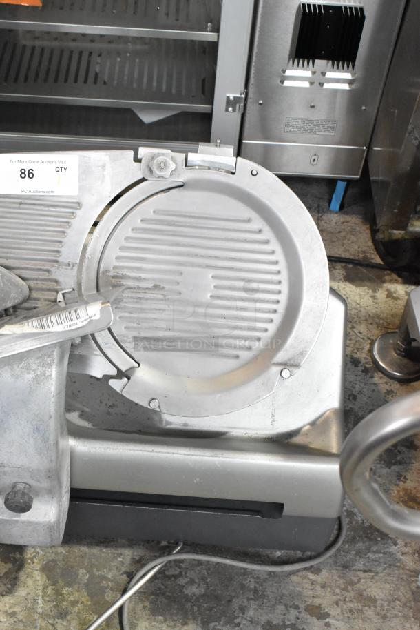 Hobart 2912 stainless steel commercial meat slicer, 120V, 1 phase. Features automatic operation. Some wear visible.