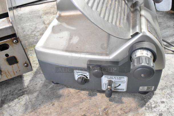 Hobart 2912 stainless steel automatic meat slicer, commercial-grade, 120 volts, 1 phase, with speed selector knob.
