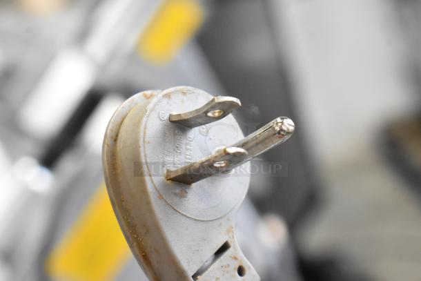 Electrical plug for a Hobart 2912 Stainless Steel Commercial Meat Slicer, showing wear. 120 Volts, 1 Phase.
