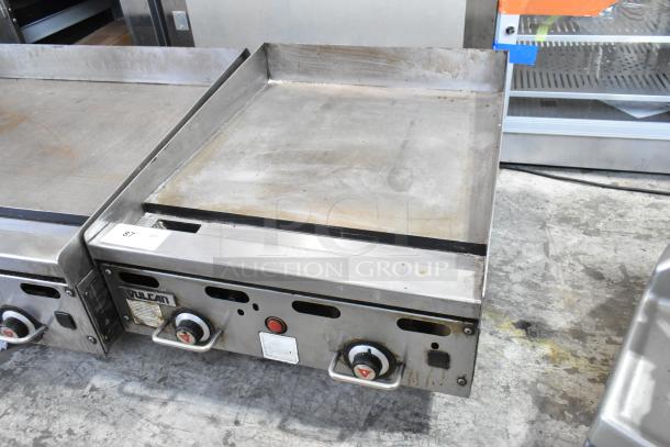Vulcan stainless steel commercial countertop gas griddle with temperature knobs, slight wear, model label visible.