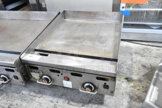Vulcan stainless steel commercial countertop gas griddle with temperature knobs, slight wear, model label visible.