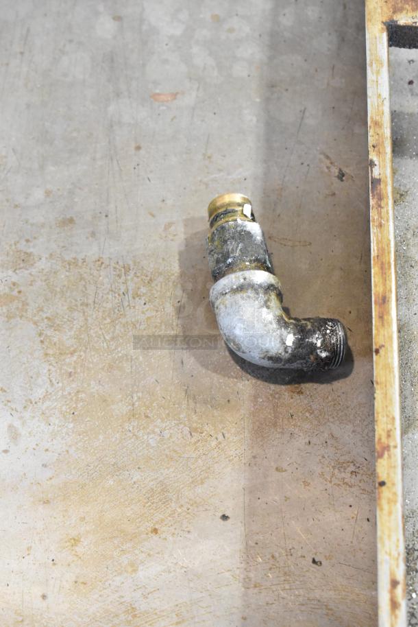 Vulcan Stainless Steel Commercial Gas Griddle, well-used, showing fittings and surface wear, ideal for professional kitchens.