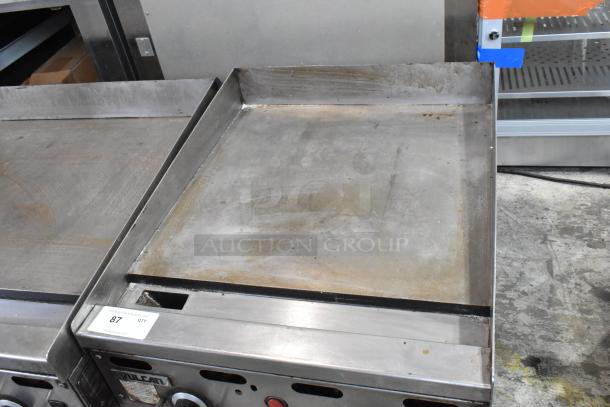 Vulcan stainless steel commercial countertop gas griddle; flat top, used condition, visible Vulcan branding.