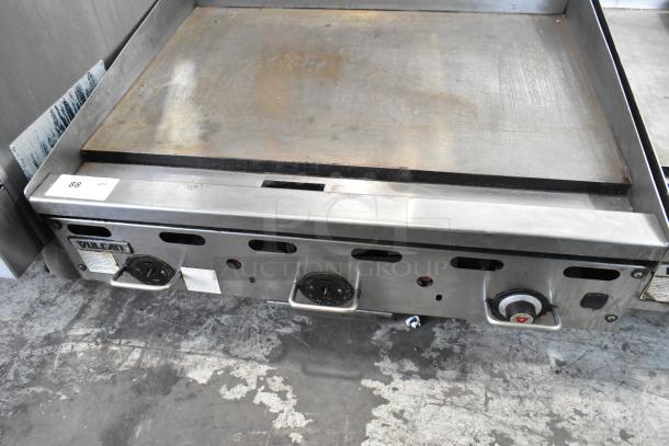 Vulcan stainless steel gas flat top griddle, commercial countertop model, used condition, visible Vulcan branding.
