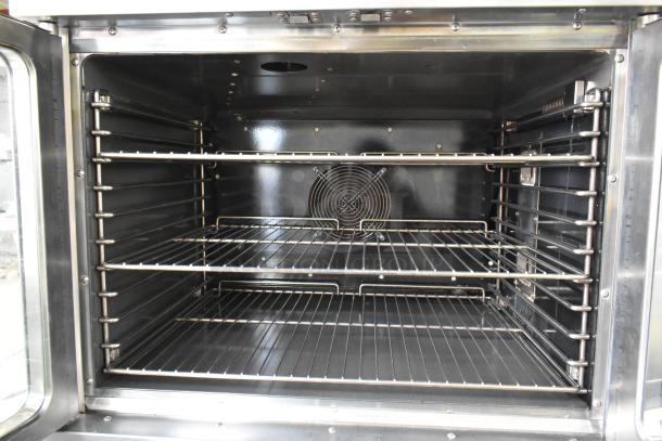 L&J NY stainless steel convection oven, full-size, view-through doors, metal racks, thermostatic controls, commercial casters.