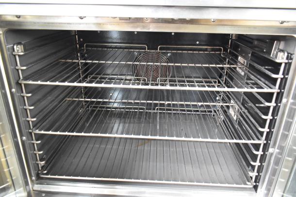 L&J NY stainless steel convection oven with view-through doors, metal racks, and thermostatic controls on casters.