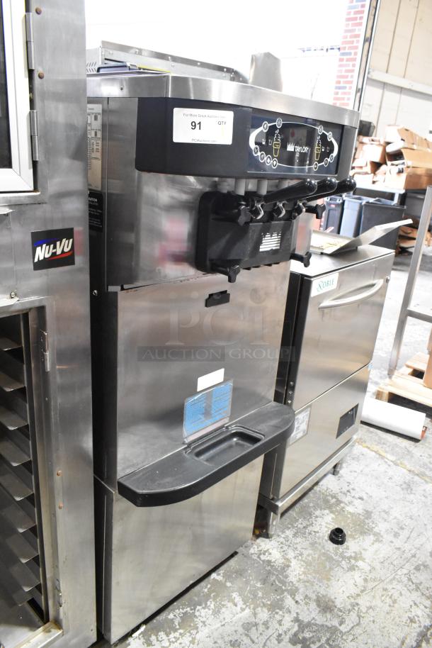 Taylor C723-33 stainless steel 2-flavor soft serve ice cream machine, floor style, water-cooled, on commercial casters.