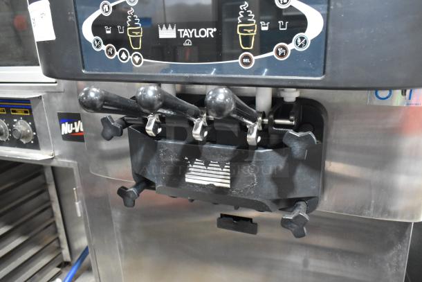 Taylor C723-33 stainless steel commercial soft serve ice cream machine, 2 flavor with twist, on casters, 208-230V, 3 phase.