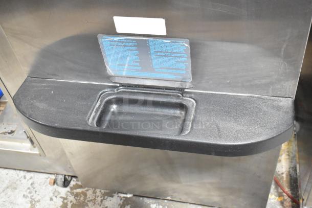 Taylor C723-33 stainless steel commercial soft serve ice cream machine, water-cooled, two flavors with twist, on casters.