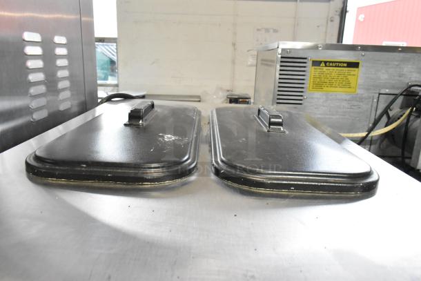 Taylor C723-33 stainless steel 2-flavor twist soft serve machine, water-cooled, on casters, 208-230V, 3 phase.