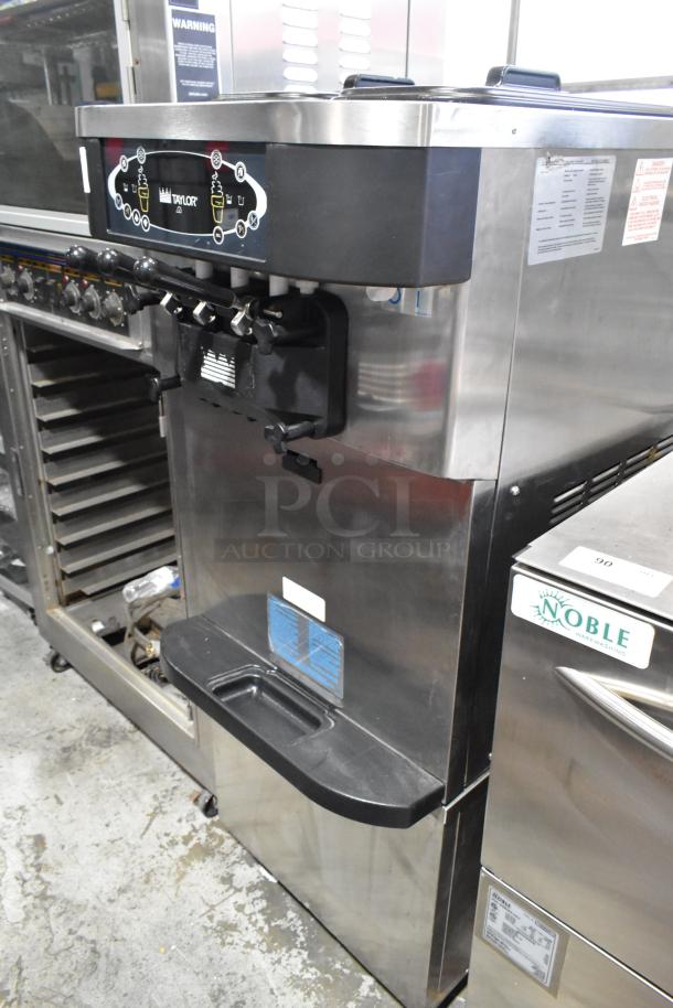 Taylor C723-33 stainless steel soft serve machine, two flavors with twist, commercial casters, water-cooled, 208-230V, 3-phase.