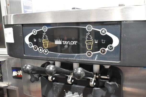 Taylor C723-33 stainless steel soft serve machine, dual flavor with twist, water cooled, on commercial casters.
