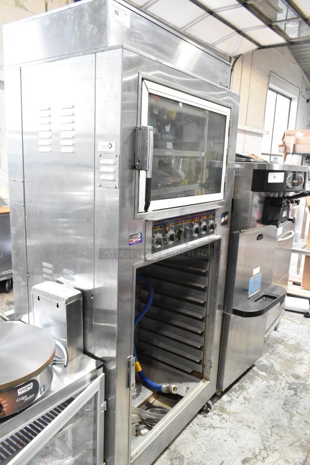 Nu Vu SUB-123 stainless steel oven proofer, missing lower door, on casters. 240V, 3-phase. Controls and labels visible.