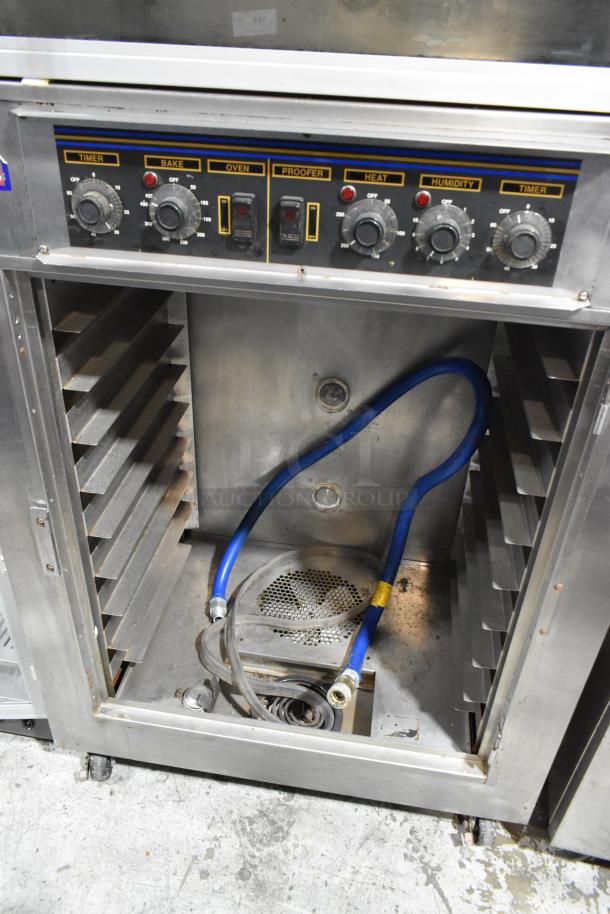 Nu Vu SUB-123 stainless steel commercial oven proofer on casters, missing lower door, 240V, 3-phase. Control panel visible.