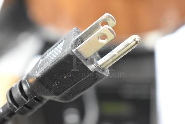 Close-up of a two-pronged power plug for Town 56916W Metal Countertop Rice Cooker, 120 Volts, 1 Phase.