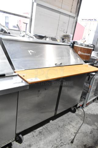 Beverage Air SPE48-18M stainless steel prep table on casters, ideal for sandwiches and salads, 115V, good condition.