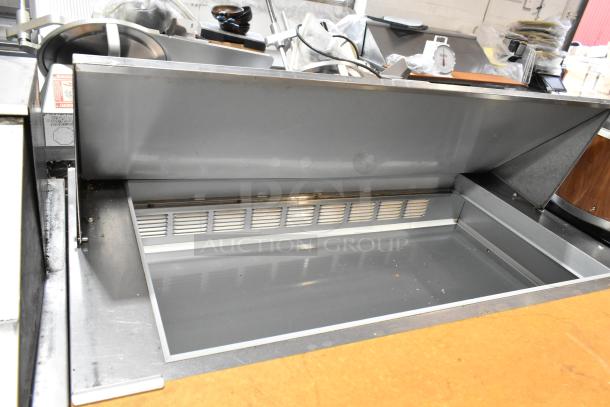 Beverage Air SPE48-18M stainless steel prep table, mega top, on commercial casters. Open lid, clean interior, 115 volts, 1 phase.