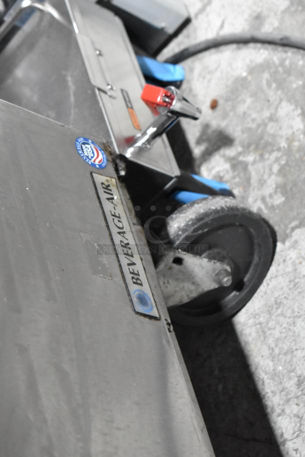 Stainless steel Beverage Air SPE48-18M sandwich prep table with casters. Label reads "Beverage Air." 115V, 1 Phase.