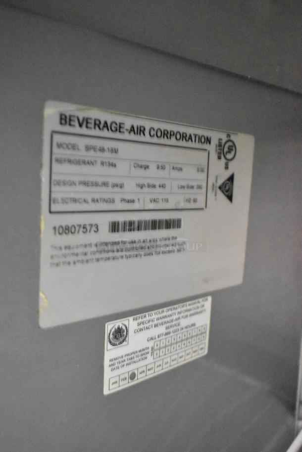 Beverage Air SPE48-18M stainless steel prep table, 115 volts, 1 phase, model tag visible, on commercial casters.