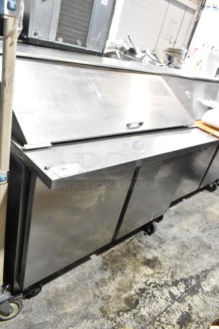 Beverage Air SPE48-18M-HMP stainless steel sandwich prep table on casters, 115V, single phase, with storage compartments.