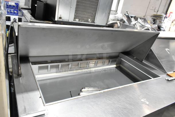 Beverage Air SPE48-18M-HMP stainless steel sandwich prep table with mega top, commercial casters, 115V, 1 phase, good condition.