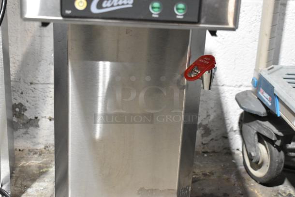 Curtis TLP12A19 stainless steel commercial coffee machine with hot water dispenser, shows control panel and dispenser.
