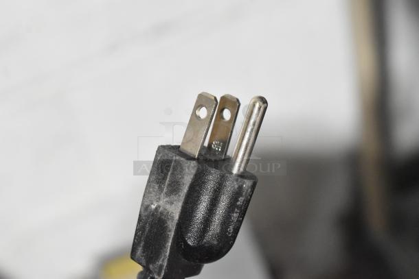 Black power plug for Curtis TLP12A19 coffee machine, showing three prongs, suitable for 120 volts, 1 phase.