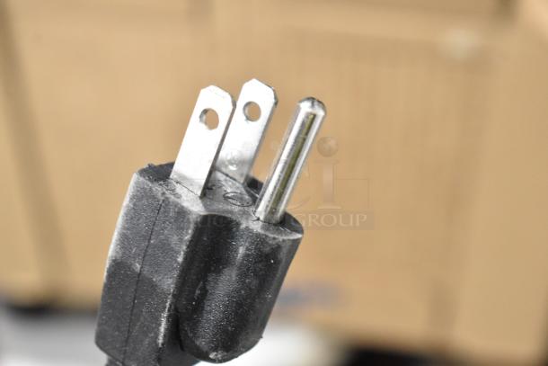 Close-up of a grounded plug for the 2025 Vita-Mix VM0805B Stainless Steel Commercial Countertop Drink Mixer.