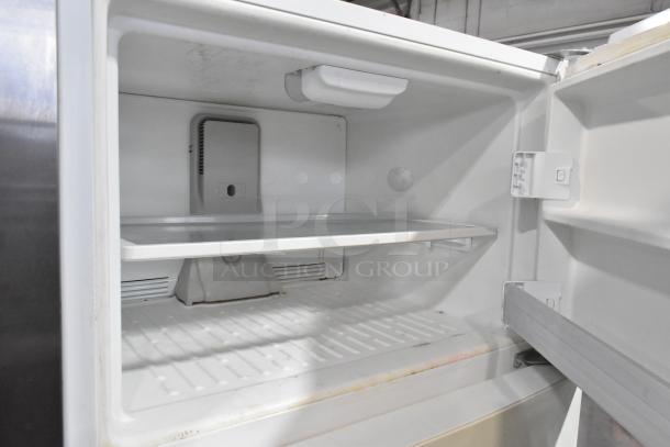 Whirlpool WRT511SZDW00 Reach-In Cooler with Freezer, interior view, 115 volts, 1 phase, clean, functional shelves.