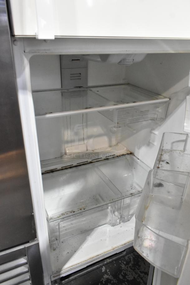 Whirlpool WRT511SZDW00 reach-in cooler with freezer, showing interior shelves; used condition, 115 volts, 1 phase.