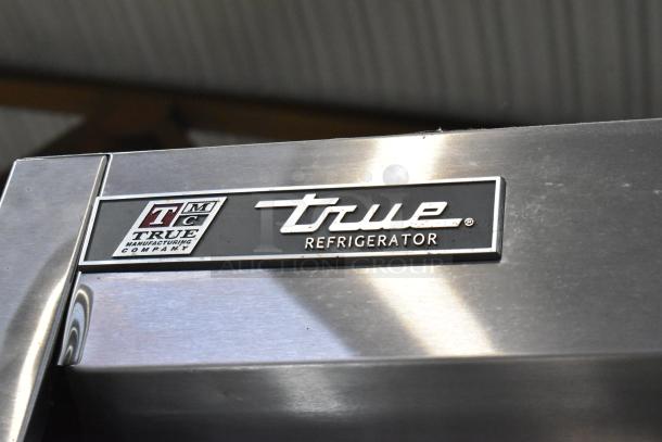 2017 True T-35 stainless steel commercial cooler, 2 doors, with poly coated racks, on commercial casters, 115V, 1-phase.