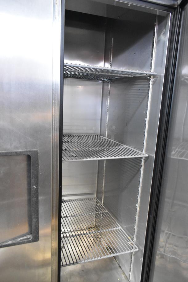 2017 True T-35 stainless steel commercial 2-door reach-in cooler with poly coated racks, on commercial casters, 115 volts, 1 phase.