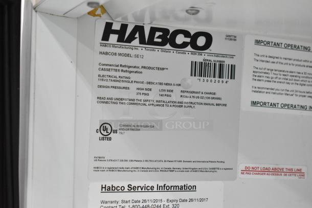 Habco SE12 commercial reach-in cooler, single door, metal, 115V, 1 phase, UL listed, with poly-coated racks, model and service info visible.