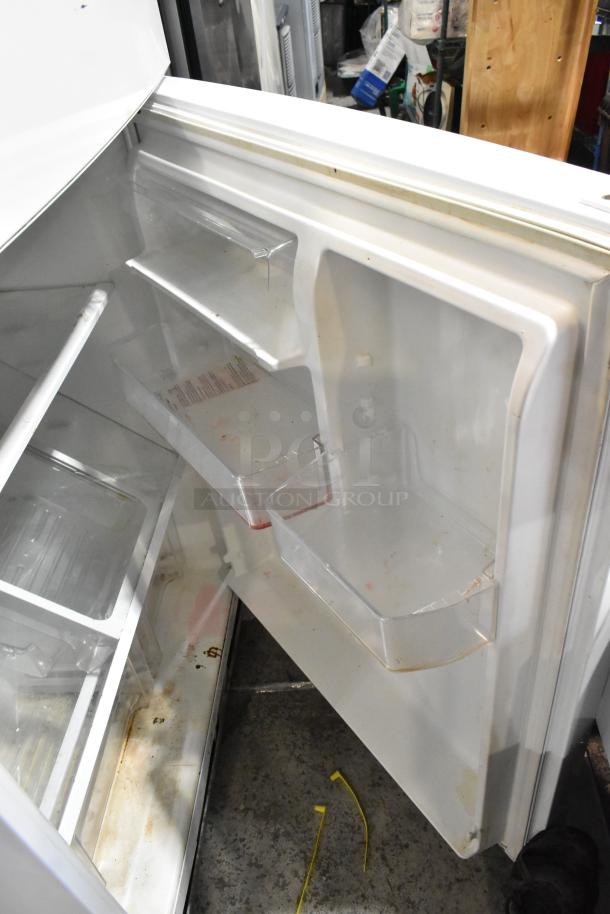 Whirlpool WRT511SZDW00 reach-in cooler with freezer. Visible shelving, minor wear, 115 volts, 1 phase power.