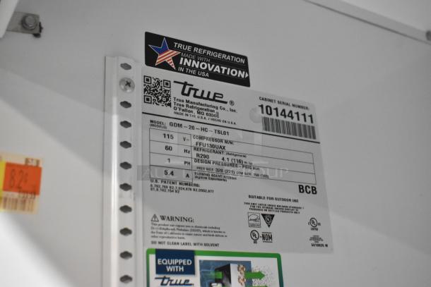 2021 True GDM-26-HC cooler tag showing model, voltage, and compressor details. Suitable for outdoor use.